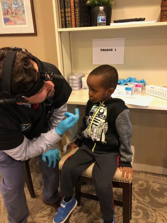 Oral Surgeon Dr. D'Amico with a pediatric patient 